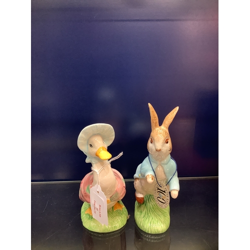 10 - A Beswick 100 Anniversary Beatrix Potter figurine 'Peter Rabbit' together with a Beswick ware 'Jemim... 