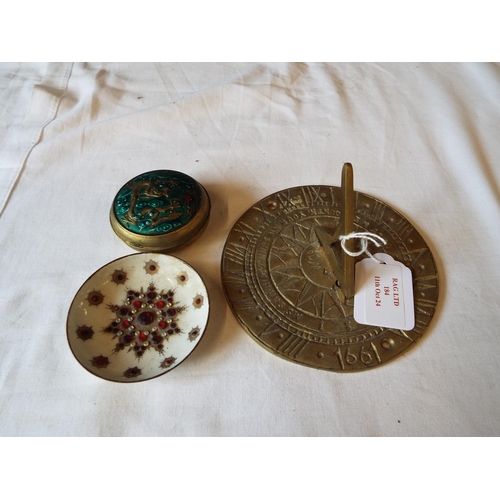 184 - An enamel lidded pot and pin dish together with a brass sun dial