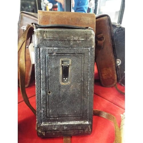 196 - A vintage Goerz Tenax Berlin folding camera housed in a leather case