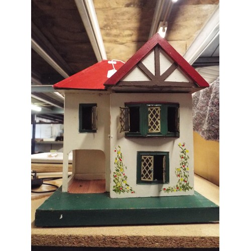 489 - A vintage child's dolls house