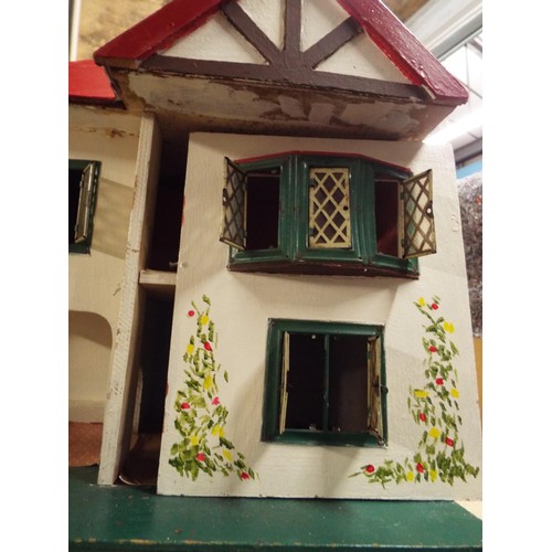 489 - A vintage child's dolls house