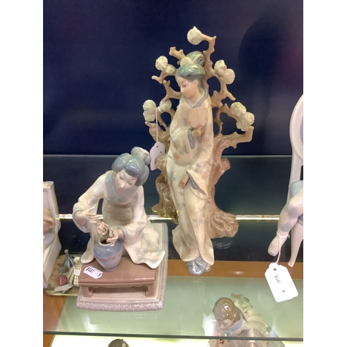 11 - A Lladro figurine of a Japanese Geisha with fan No 4807 A/F together with another