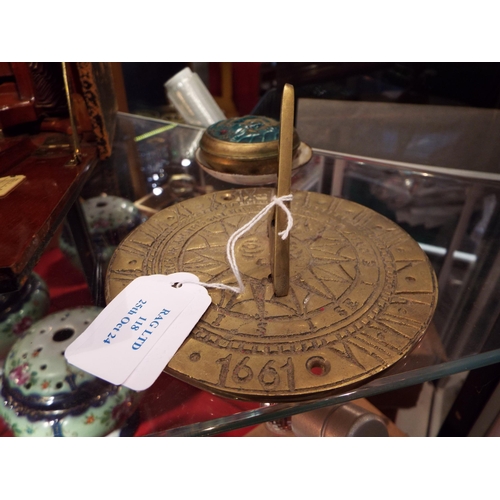 118 - An enamel lidded pot and pin dish together with a brass sun dial