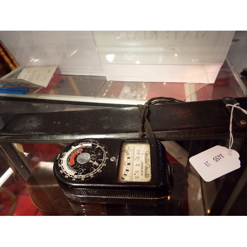 126 - A Weston Master universal exposure meter together with a slide rule