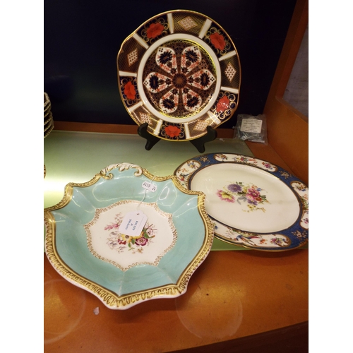 36 - A Royal Crown Derby Imari patterned plate together with a Royal Doulton cabinet plate plus another