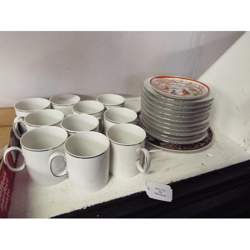 320 - Two Oriental plates together with Thomas of Germany cups and saucers with silver coloured rim's