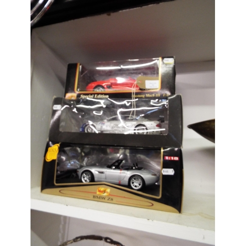 326 - A boxed Maisto BMW Z8, a boxed Mercedes-Benz Original-Teile AMG Mercedes CLK and a boxed Maisto Spec... 