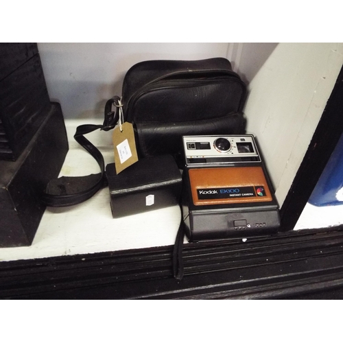 342 - A Kodak EK100 and an Instamatic camera