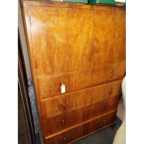 369 - An Art Deco walnut veneer tall boy with four long drawers