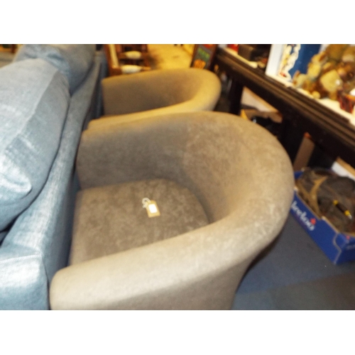 373 - A pair of Ikea style brown upholstered tub chairs