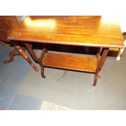376 - An Arts and Crafts mahogany table on castors
