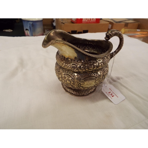 134 - A Dublin 1824 silver embossed cream jug weighing 9.09oz