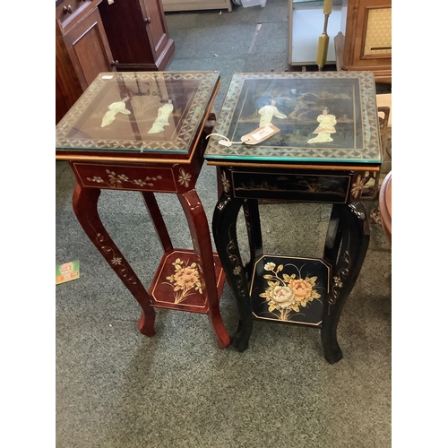 447 - A black and red Chinese lacquered pair of jardinière stands with mother of pearl and gilt decoration