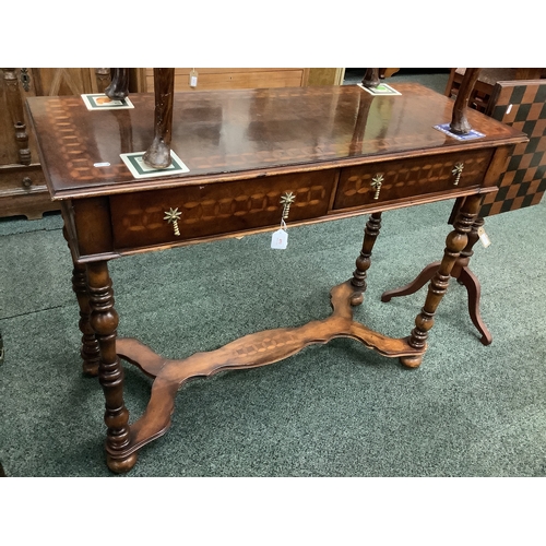 451 - A reproduction burr walnut and inlaid console table having two frieze drawers above turned supports ... 