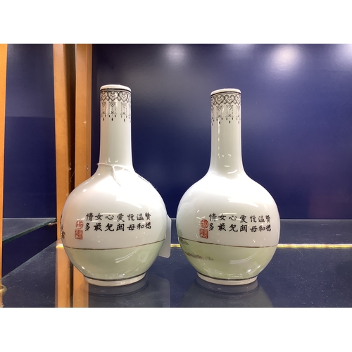 3 - Two Chinese porcelain bottle vases depicting a female and child decoration, marks to base