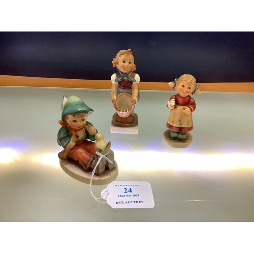 24 - Three Goebel figurines 'Singing Lesson', 'Little Helper' and ‘Isabelle Blooms’