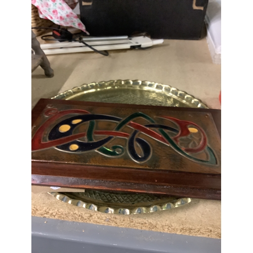 596 - An Indian engraved brass tray together with a Celtic style copper plaque