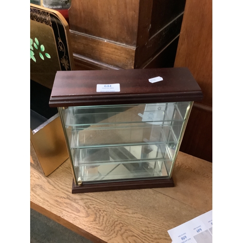 644 - A small three glass shelved display cabinet