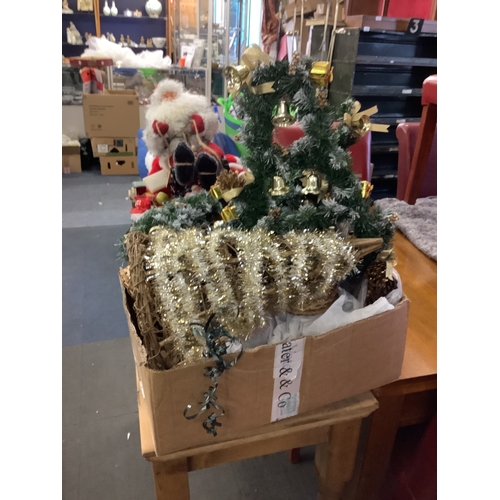 701 - A large selection of Christmas decorations to include Santa Claus, babbles etc