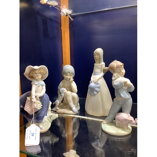 20 - Four figurines to include Lladro, Bavaria, Valencia and a Nao example