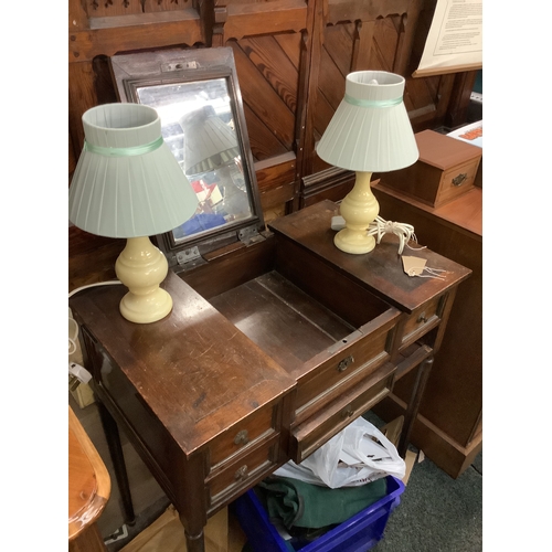 650 - An oak ladies vanity chest with lift up mirror resting on tuned supports