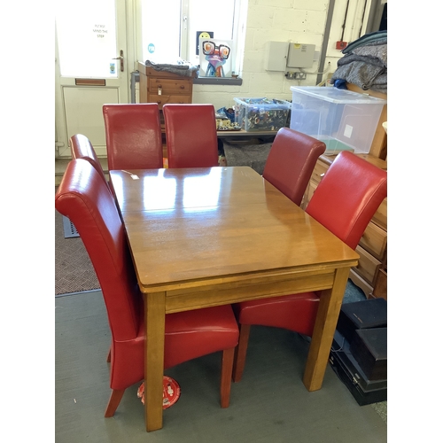 703 - A Julian Bowen extending dining table a set of four leather chairs and two others