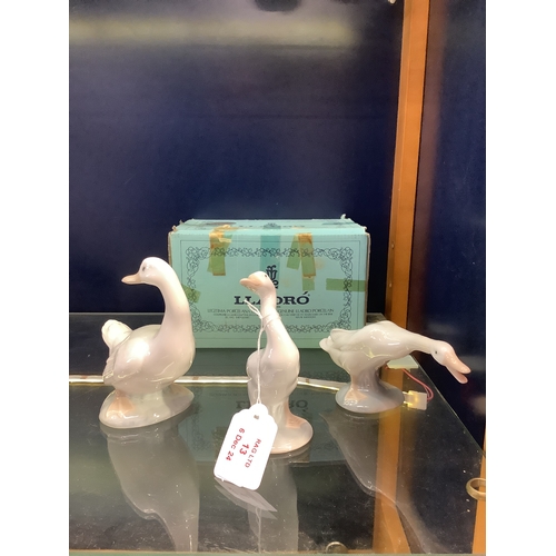 13 - Two Lladro 'Geese' together with a Nao Duck