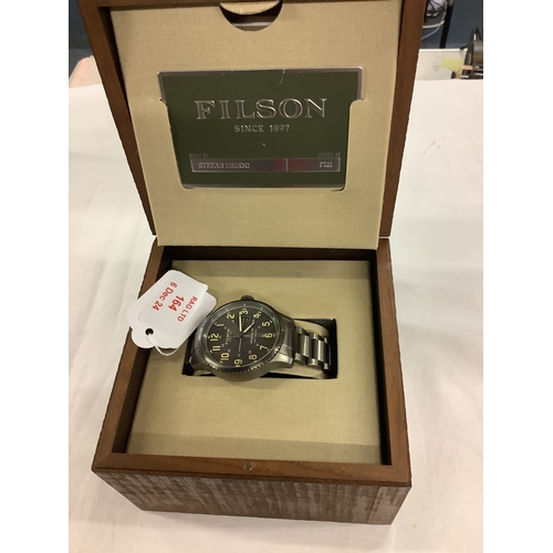 164 - A box as new Filson stainless steel wristwatch the dial having date aperture with certificate