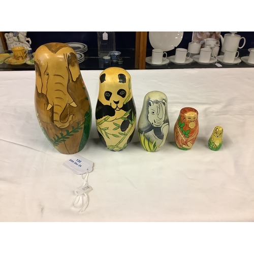 130 - A set of Matryoshka stacking dolls with hand-painted animal decoration