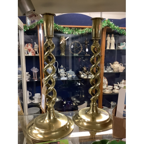 142 - A pair of brass barley twist candlesticks