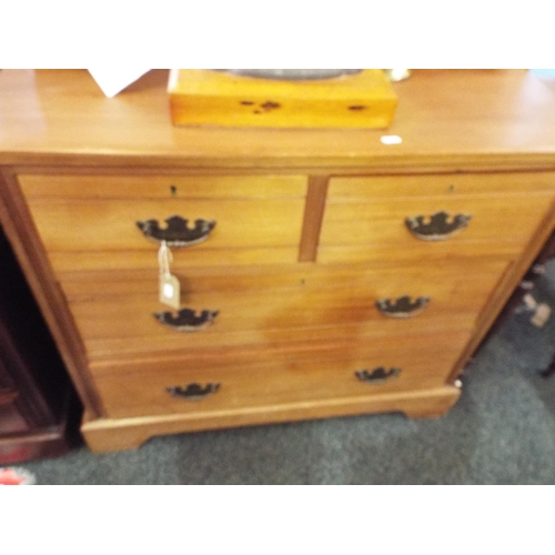 573 - A teak dressing table having two jewellery drawers above two short over two long drawers