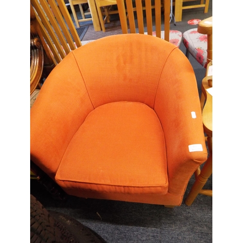 581 - A Liberty's tub chair in orange upholstery