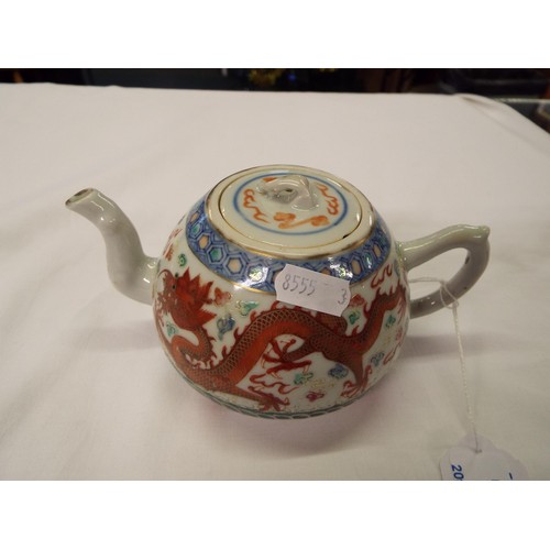 8 - A Chinese tea-pot with dragon decoration (chip to lid)