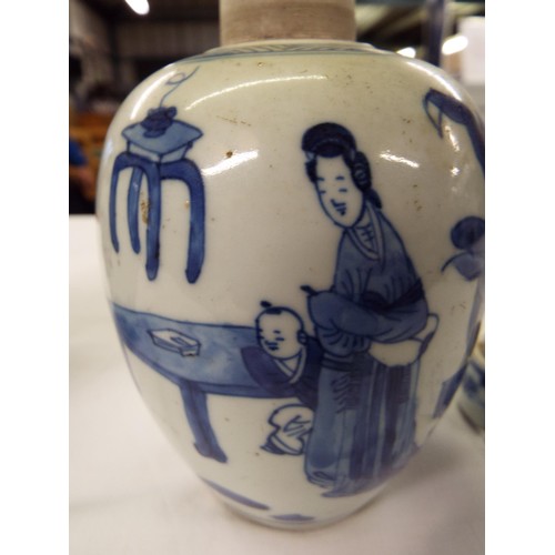 26 - Two Chinese Kangxi blue and white tea caddies having pictorial decoration resting on hardwood stands