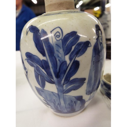 26 - Two Chinese Kangxi blue and white tea caddies having pictorial decoration resting on hardwood stands