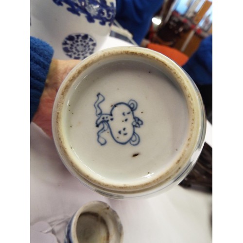 26 - Two Chinese Kangxi blue and white tea caddies having pictorial decoration resting on hardwood stands