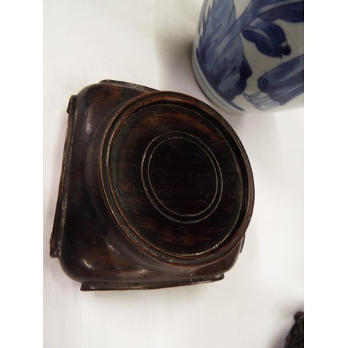 26 - Two Chinese Kangxi blue and white tea caddies having pictorial decoration resting on hardwood stands