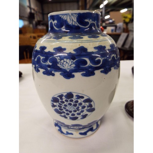 26 - Two Chinese Kangxi blue and white tea caddies having pictorial decoration resting on hardwood stands