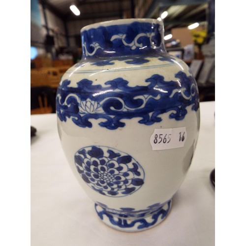 26 - Two Chinese Kangxi blue and white tea caddies having pictorial decoration resting on hardwood stands