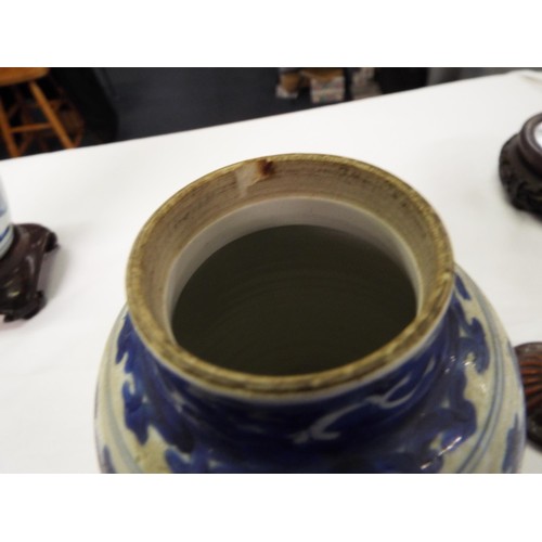 26 - Two Chinese Kangxi blue and white tea caddies having pictorial decoration resting on hardwood stands