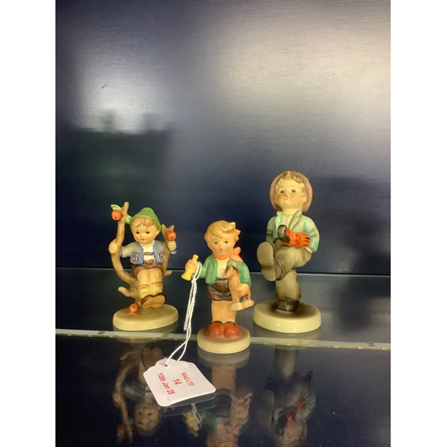 14 - Three Goebel Hummel figurines 'Boy Holding a Trumpet', No 239, 'Happy Traveler' No 109 and 'Apple Tr... 