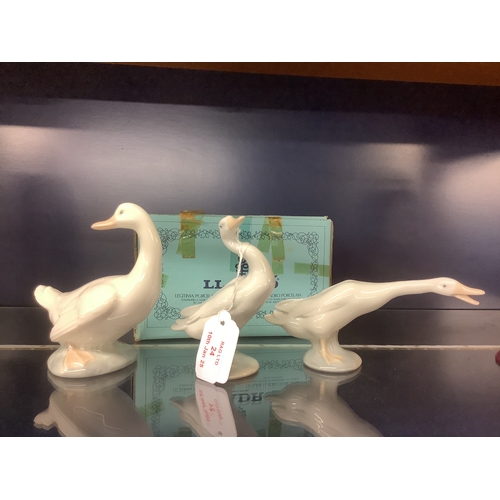 24 - Two Lladro 'Geese' together with a Nao Duck