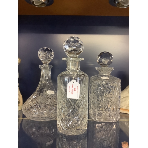 45 - Two crystal glass decanters and a ships decanter one A/F