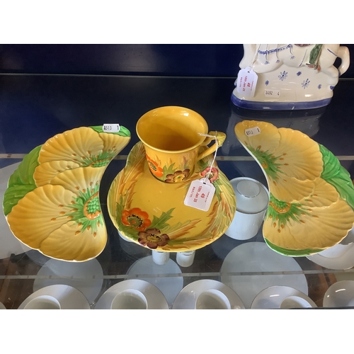 49 - A Carlton ware yellow cup and saucer from the Australian design together with two kidney shaped dish... 