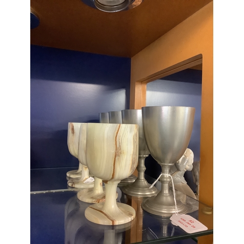 52 - Four carved alabaster goblets and four pewter goblets