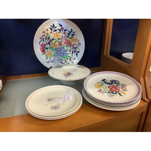 61 - A selection of Poole Pottery plates and a posy vase