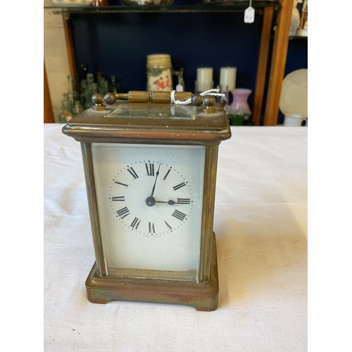 121 - A brass and glass carriage clock in working order