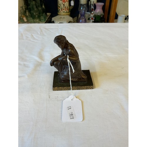 122 - A bronze figurine of a seated lady