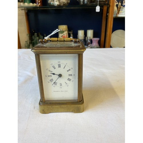 123 - A Jenner & Knewstub glass and brass carriage clock in working order