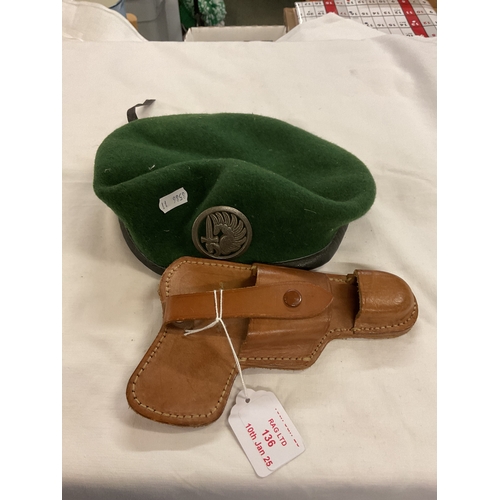 136 - A French Airbourne beret with badge attached together with a leather holster